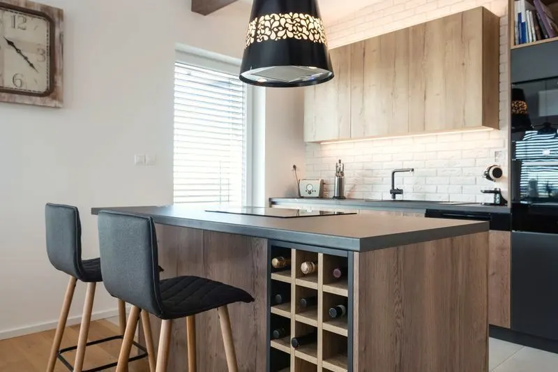 White blinds on a kitchen window beside an island